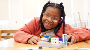 New York Edge student building legos